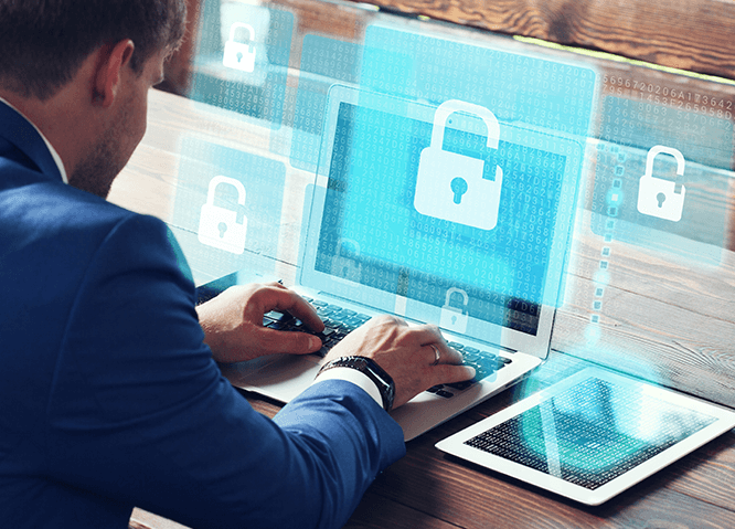 cybersecurity professional on laptop